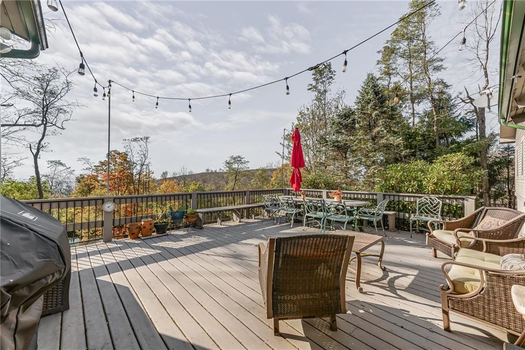256 Alpine Heights Road Champion, PA 15622 - Photo 29 of 50 a view of a balcony with wooden floor and outdoor seating