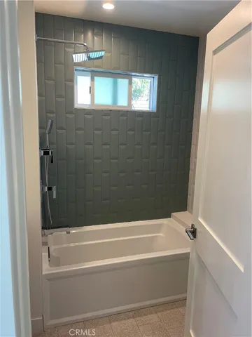 a view of a room with wooden floor and window