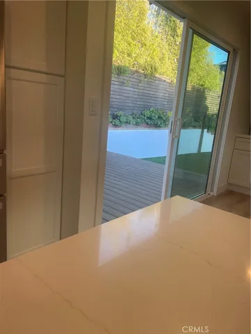 a kitchen with a stove and a refrigerator