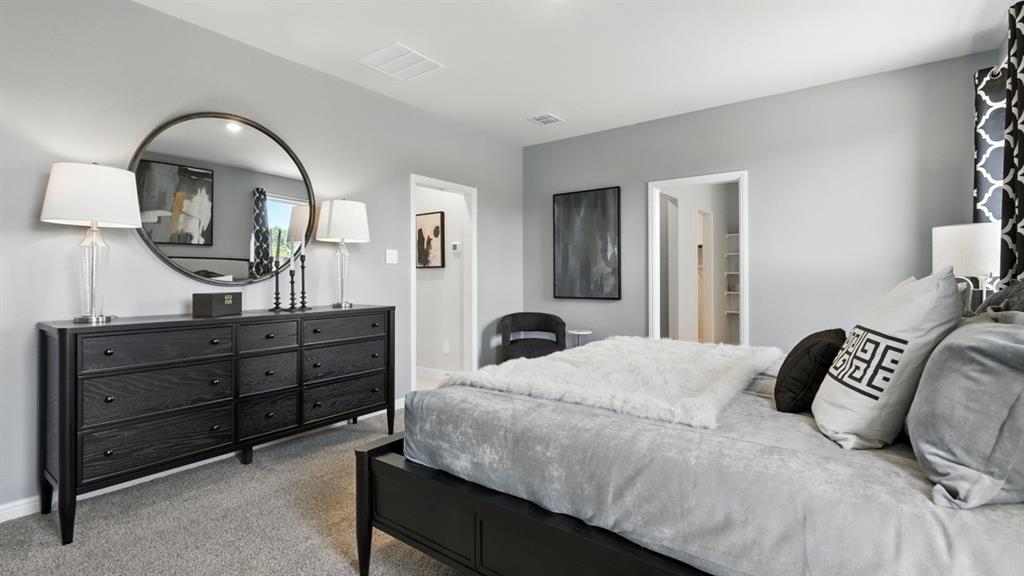 304 Perk Street Keene, TX 76059 - Photo 14 of 34 a bedroom with a bed and a dresser