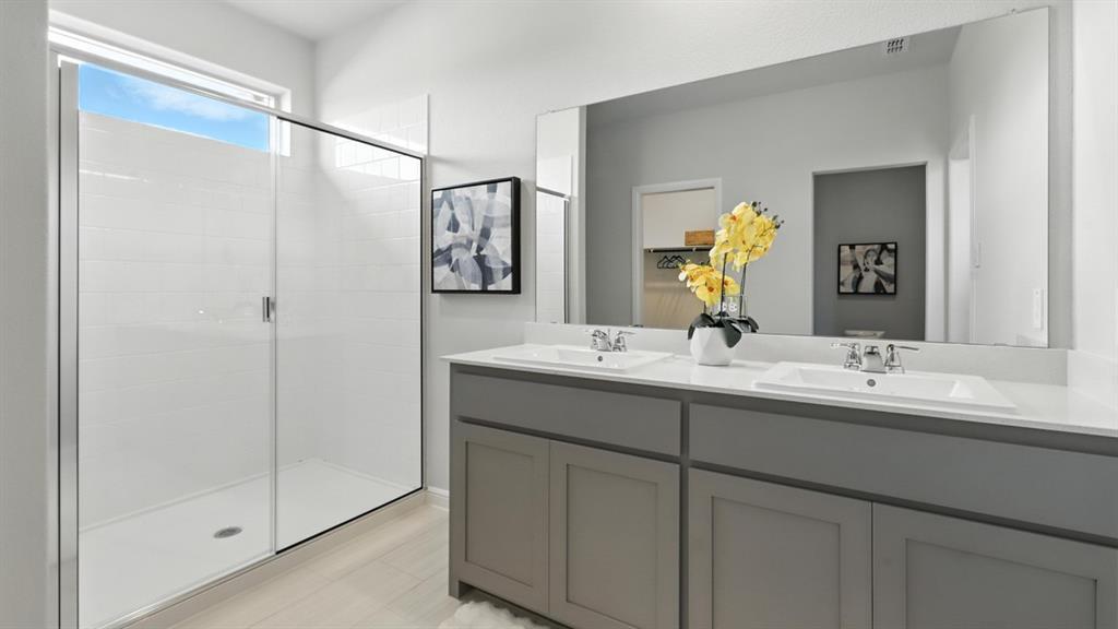 304 Perk Street Keene, TX 76059 - Photo 17 of 34 a bathroom with a double vanity sink mirror and shower