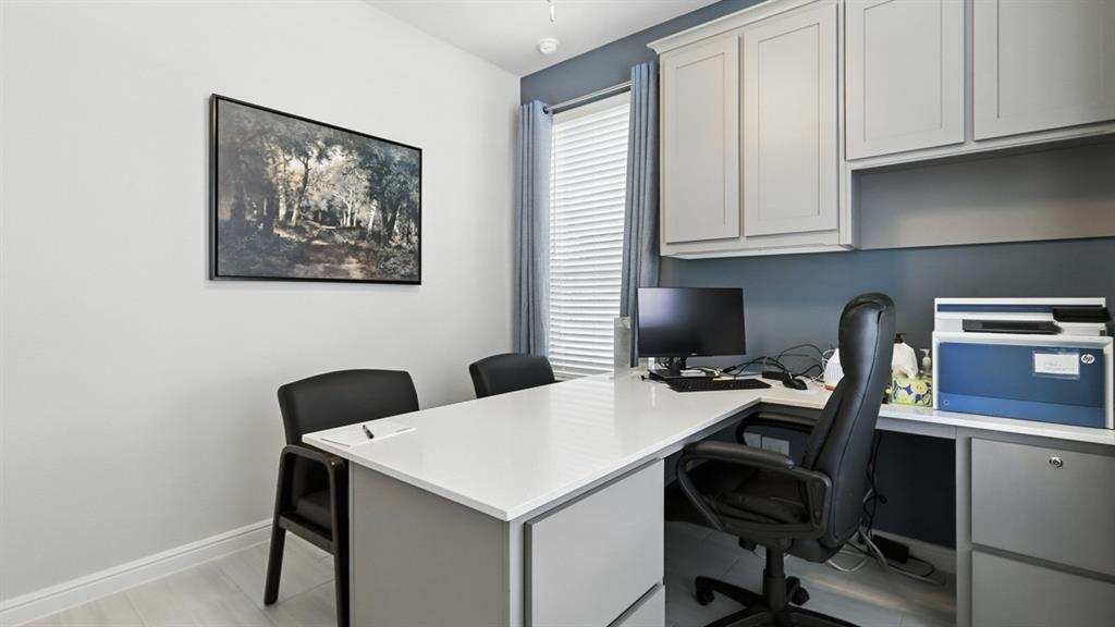 304 Perk Street Keene, TX 76059 - Photo 21 of 34 a view of a workspace with furniture and wooden floor