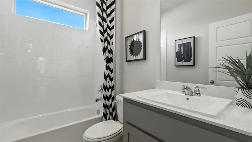 304 Perk Street Keene, TX 76059 - Photo 24 of 34 a bathroom with a sink toilet and shower