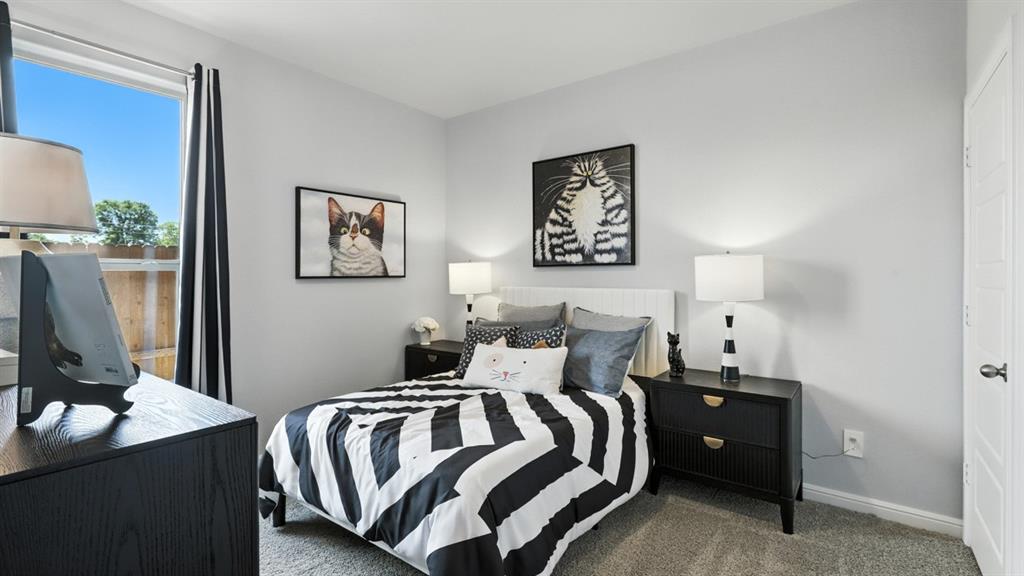 304 Perk Street Keene, TX 76059 - Photo 26 of 34 a bedroom with a bed and wooden floor