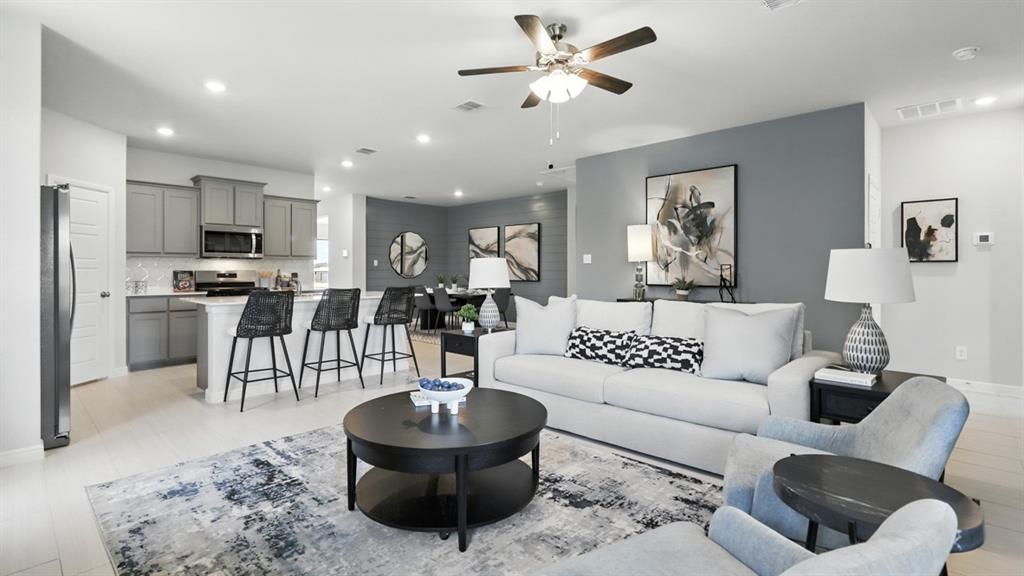 304 Perk Street Keene, TX 76059 - Photo 8 of 34 a living room with furniture and a view of kitchen