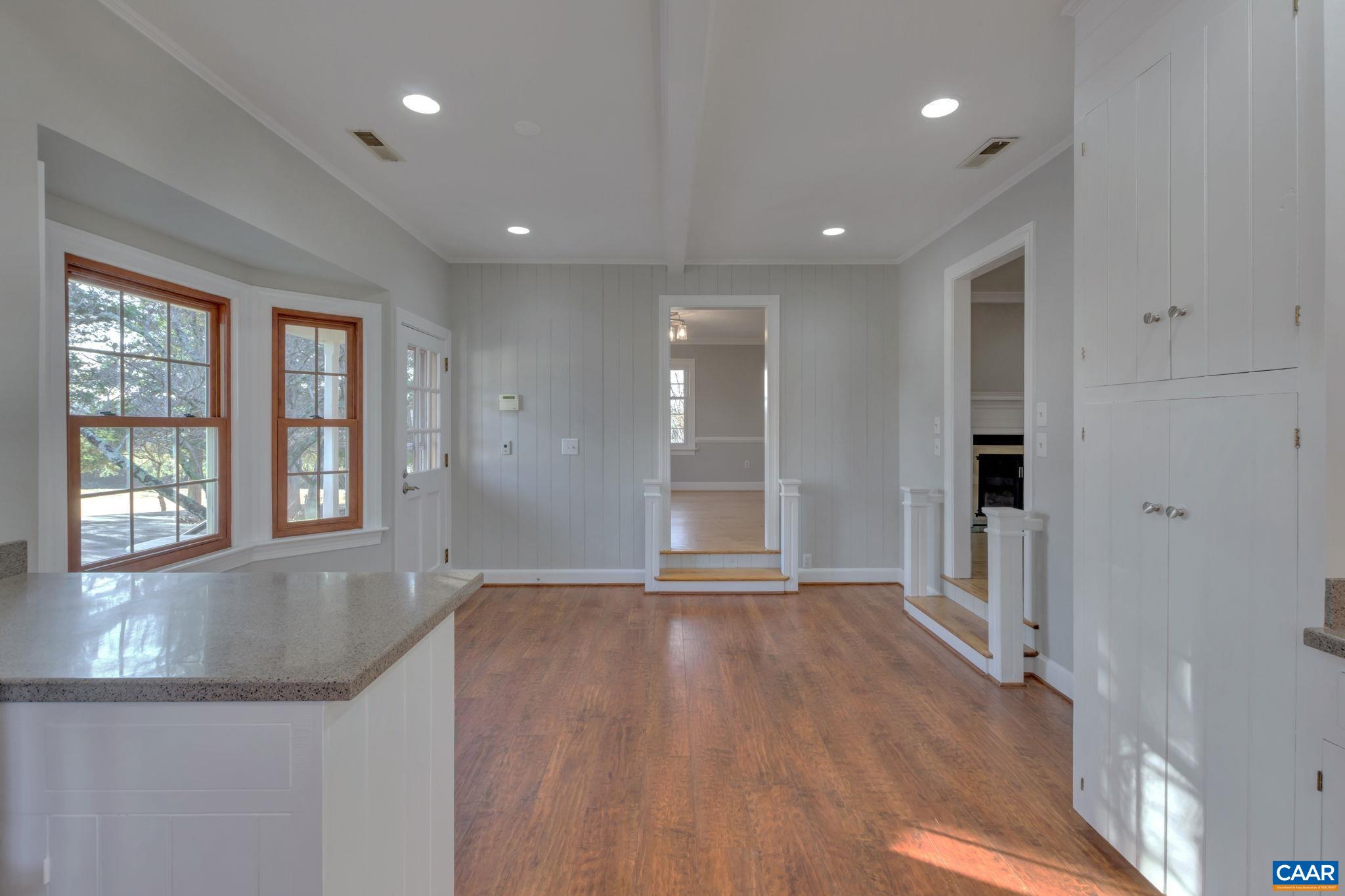 3432 Keswick Road Keswick, VA 22947 - Photo 11 of 60 a view of an empty room with wooden floor and a window
