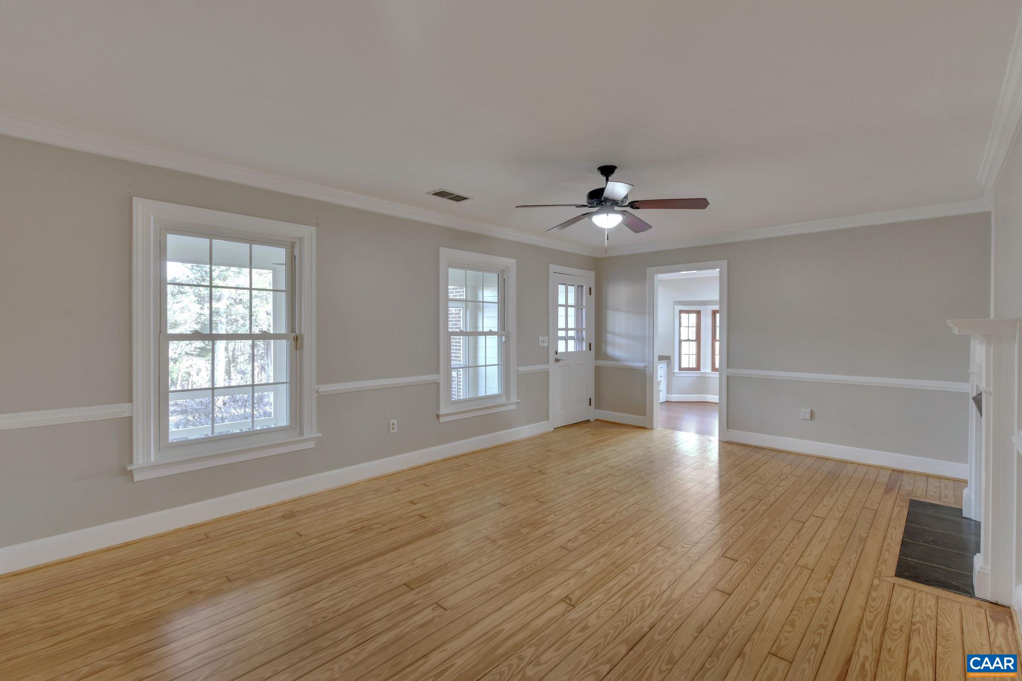 3432 Keswick Road Keswick, VA 22947 - Photo 22 of 60 a view of an empty room with a window and wooden floor