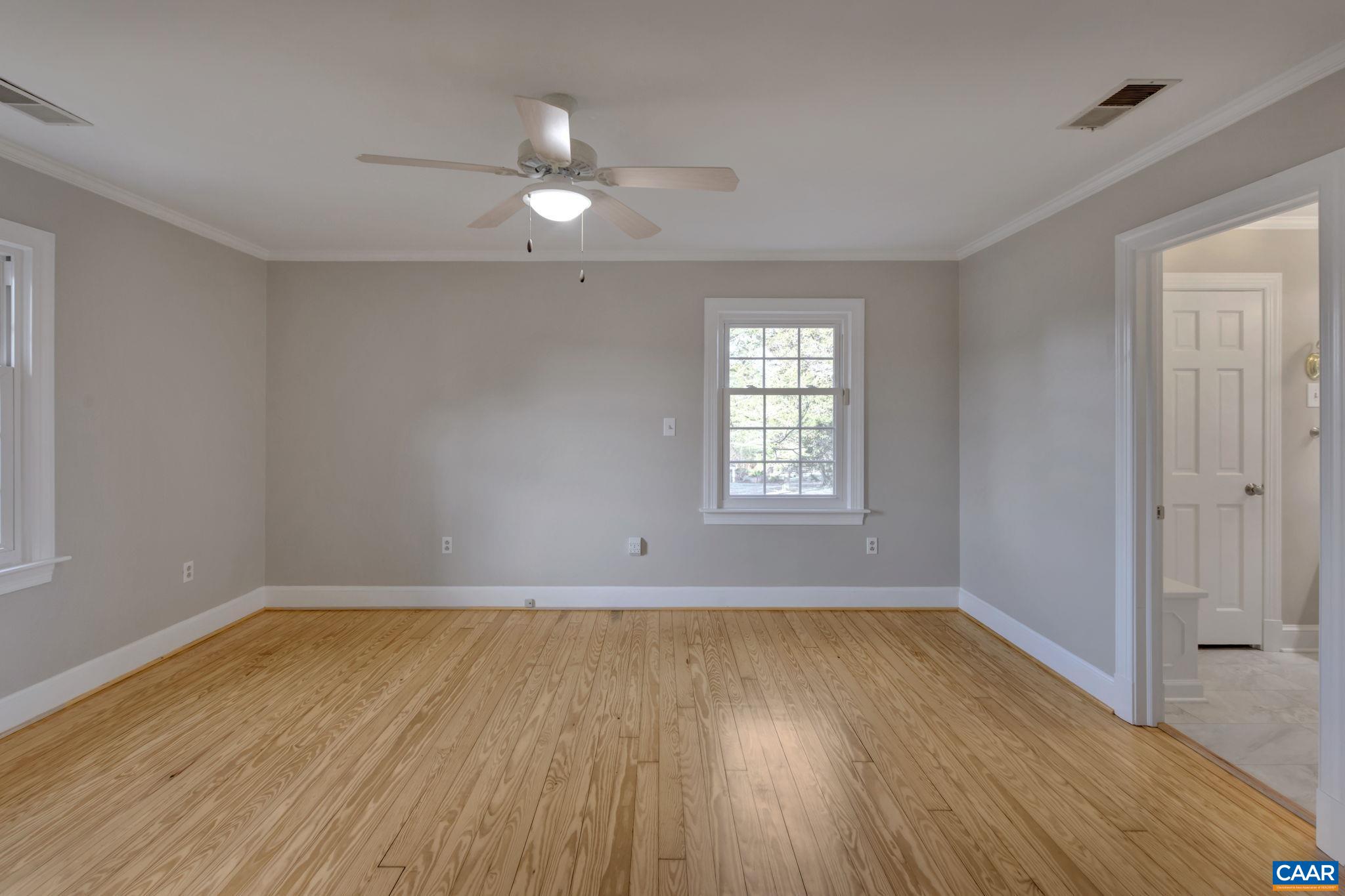 3432 Keswick Road Keswick, VA 22947 - Photo 29 of 60 an empty room with wooden floor and windows