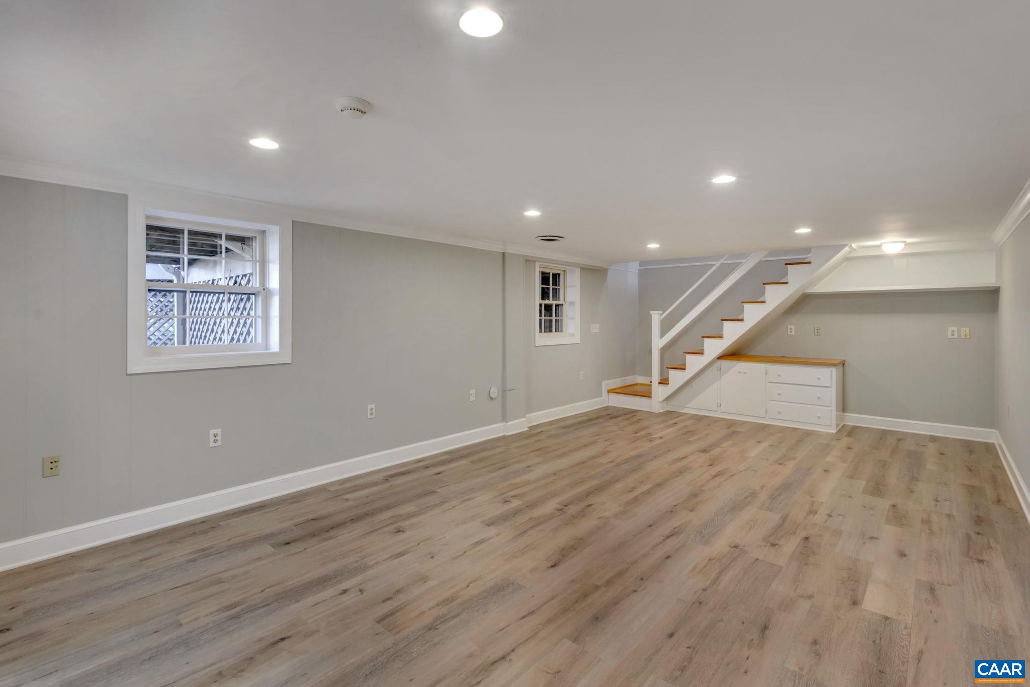 3432 Keswick Road Keswick, VA 22947 - Photo 39 of 60 a view of an empty room with wooden floor