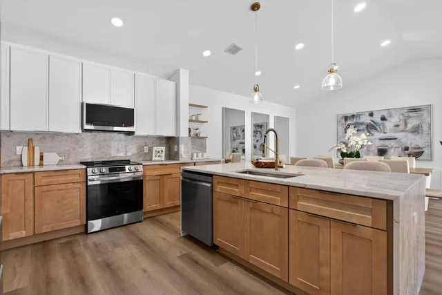 a dining room with furniture and wooden floor