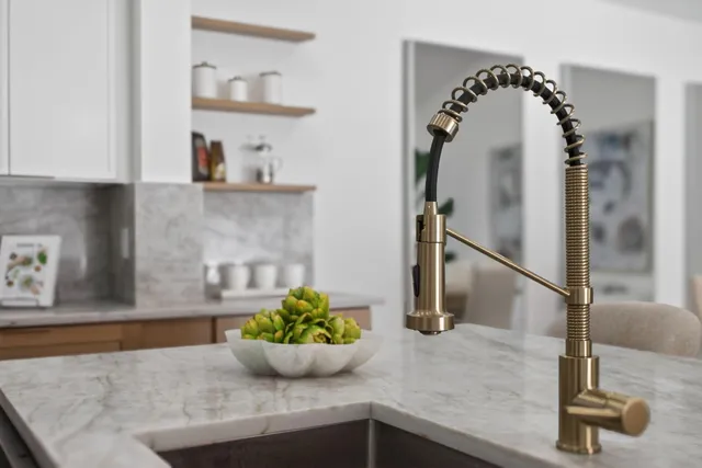a living room with furniture and a table with wooden floor