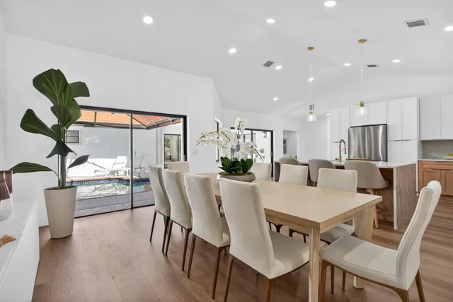 a bedroom with a large bed and a flat screen tv