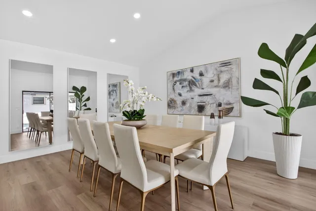 a bedroom with a large bed and a flat screen tv