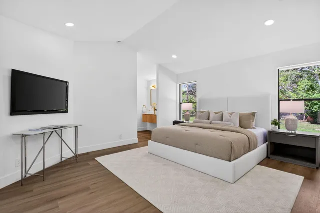 a bathroom with a double vanity sink mirror and