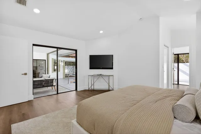 a bathroom with a shower a toilet and a sink