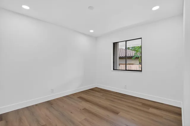 a bathroom with a sink a mirror and a shower