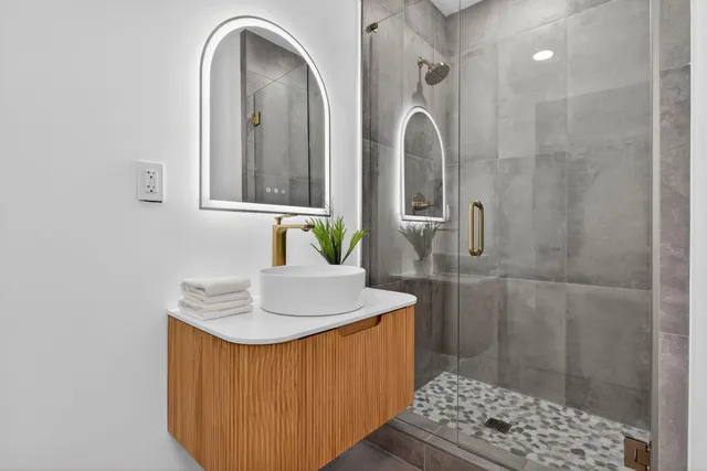 a view of a patio with table and chairs with wooden floor and plants