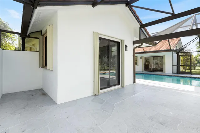 an aerial view of a house with garden space and outdoor seating