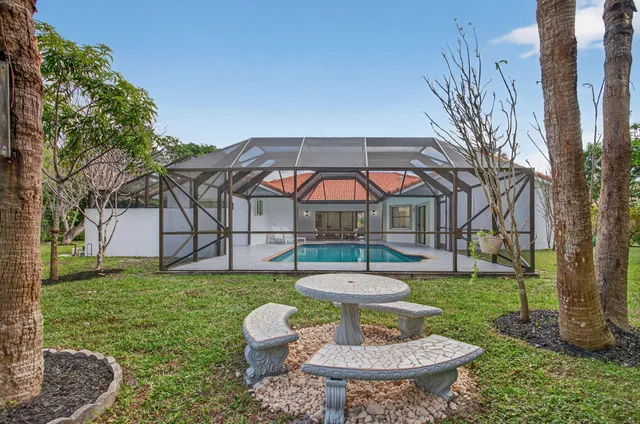 an aerial view of a house with outdoor space