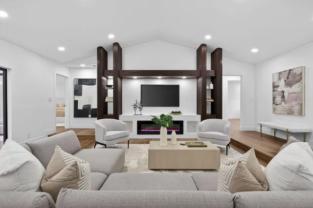 a kitchen with stainless steel appliances kitchen island granite countertop a sink and cabinets
