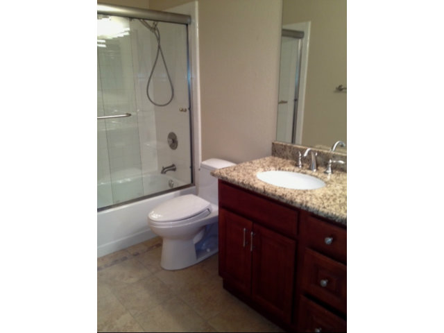 187 Redding Road Campbell, CA 95008 - Photo 16 of 24 a bathroom with a granite countertop sink toilet and shower