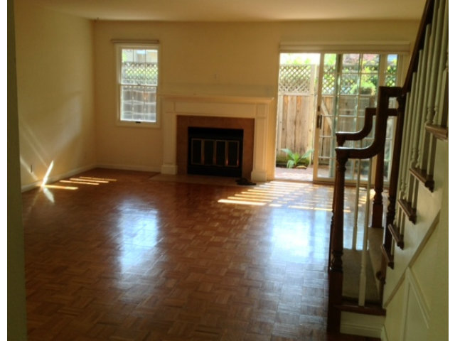 187 Redding Road Campbell, CA 95008 - Photo 4 of 24 a view of a livingroom with furniture a fireplace and wooden floor