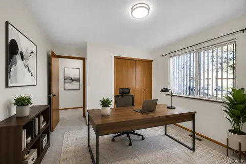 a view of a workspace with furniture