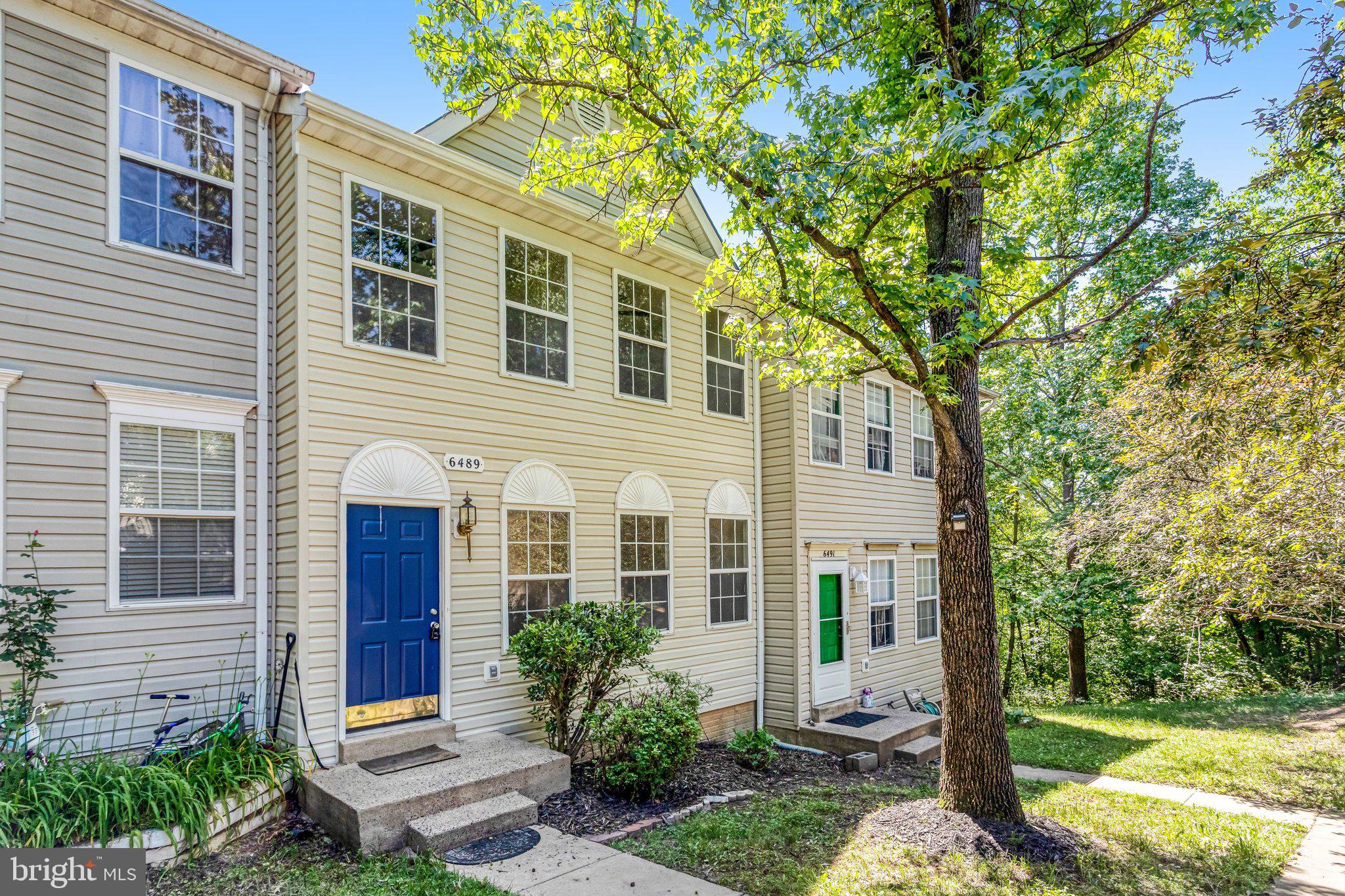 6489 McCoy Road Centreville, VA 20121 - Photo 2 of 34 Charming townhome with lush greenery.