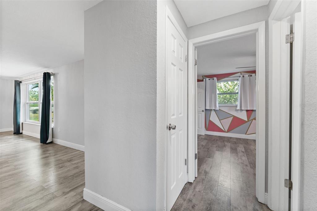 4238 Glissade Drive New Port Richey, FL 34652 - Photo 20 of 62 a view of a hallway with wooden floor and closet area