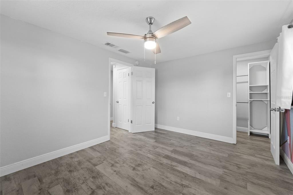 4238 Glissade Drive New Port Richey, FL 34652 - Photo 24 of 62 wooden floor in an empty room