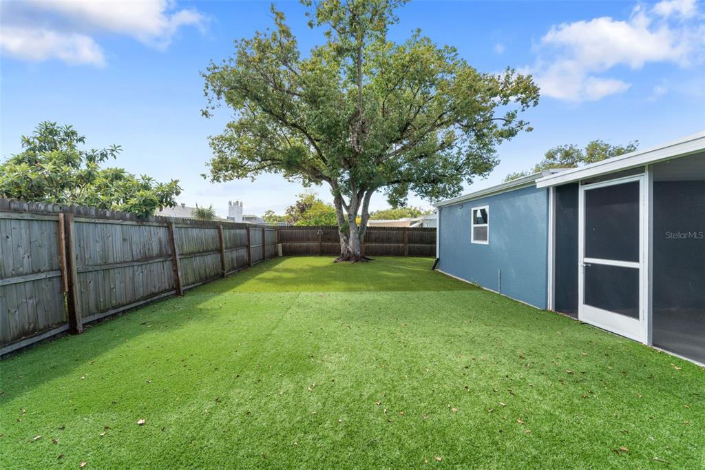 4238 Glissade Drive New Port Richey, FL 34652 - Photo 44 of 62 a view of a backyard with a garden