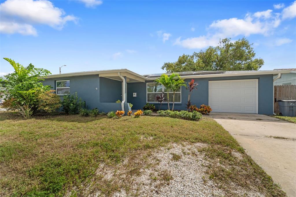 4238 Glissade Drive New Port Richey, FL 34652 - Photo 51 of 62 a view of a house with backyard and garden