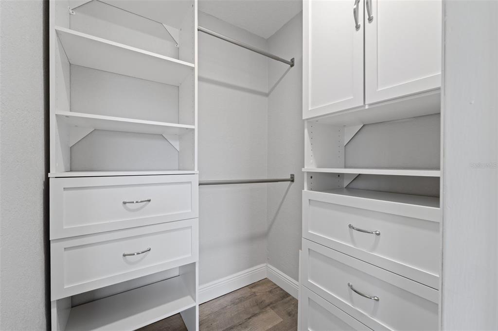 4238 Glissade Drive New Port Richey, FL 34652 - Photo 61 of 62 a view of walk in closet with empty racks