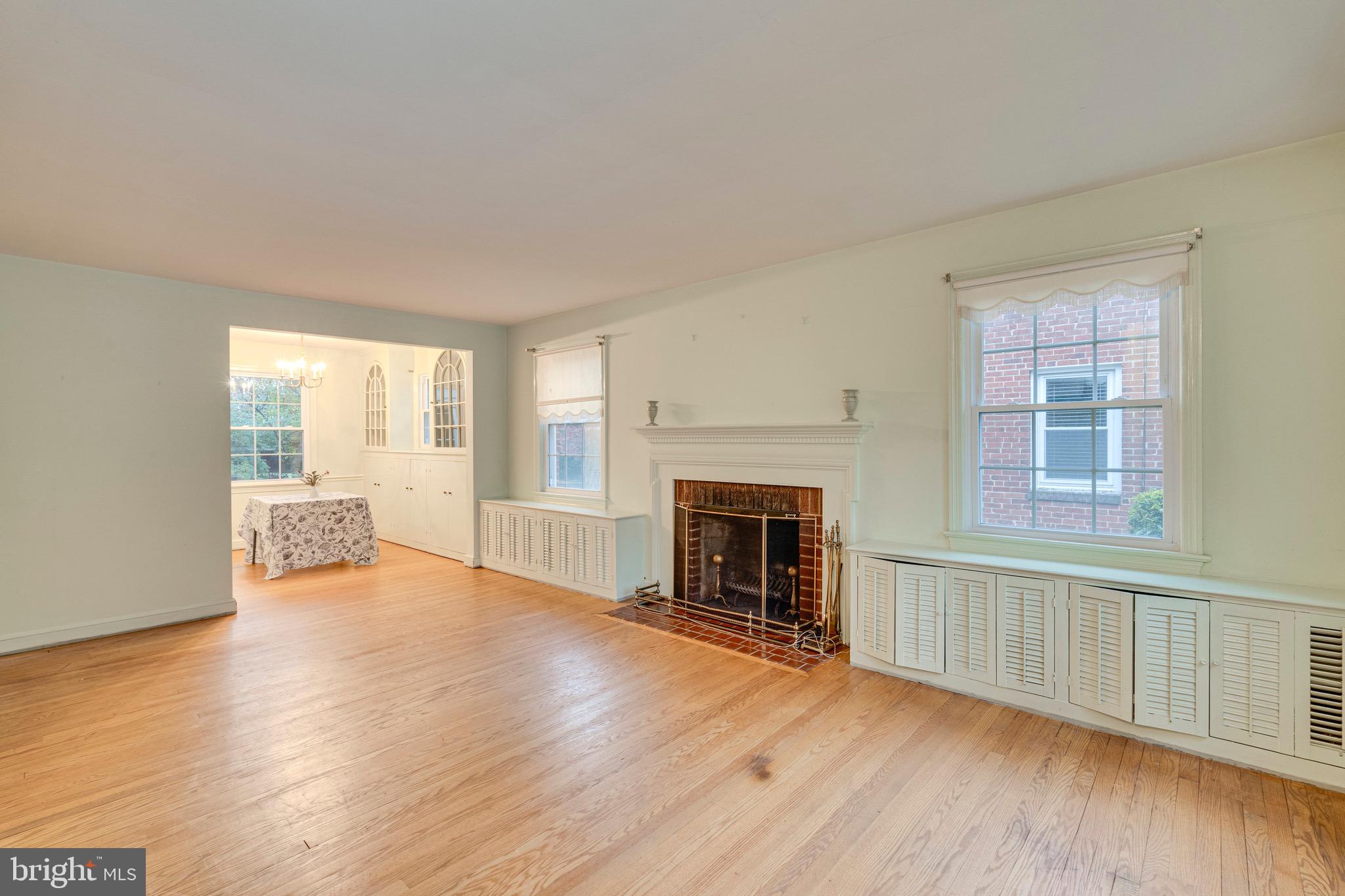 10001 Portland Road Silver Spring, MD 20901 - Photo 8 of 42 Living room with wood-burning fireplace