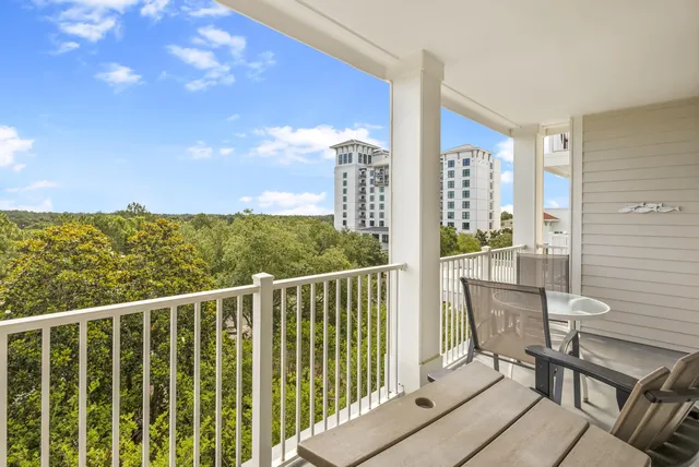 a view of a balcony with furniture