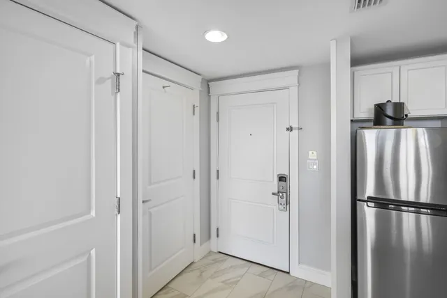 a view of bathroom with a shower and a glass door