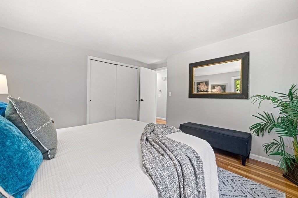 6 Coleman Road Groveland, MA 01834 - Photo 11 of 39 a bedroom with a bed and a potted plant