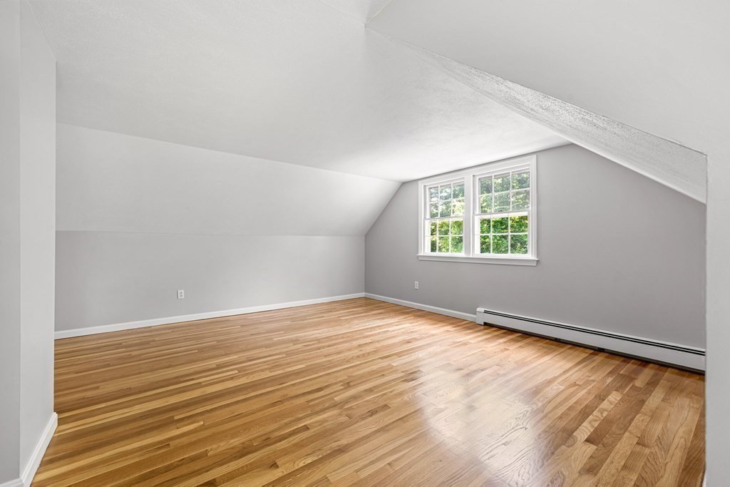 6 Coleman Road Groveland, MA 01834 - Photo 14 of 39 an empty room with wooden floor and windows