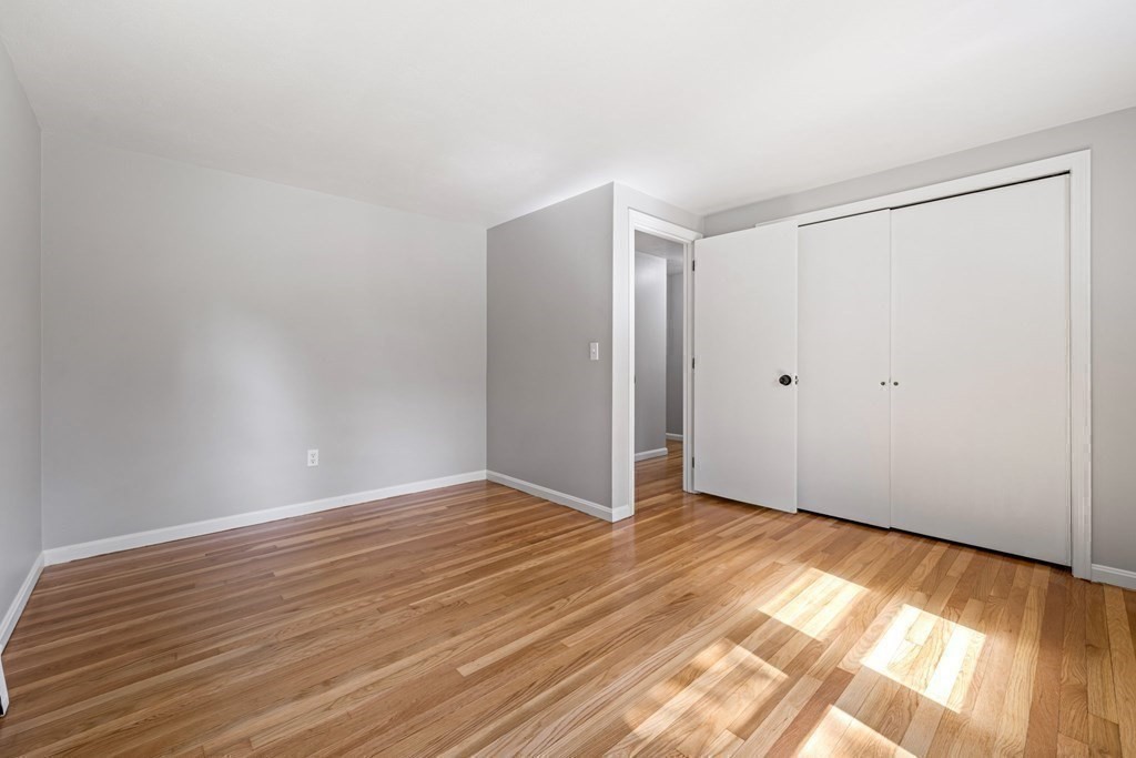6 Coleman Road Groveland, MA 01834 - Photo 18 of 39 a view of an empty room with wooden floor and a window