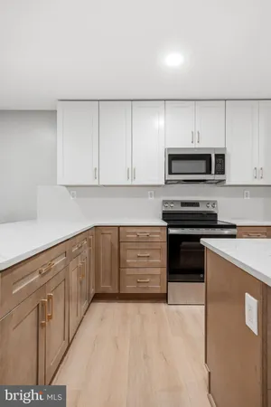 a kitchen with cabinets and appliances