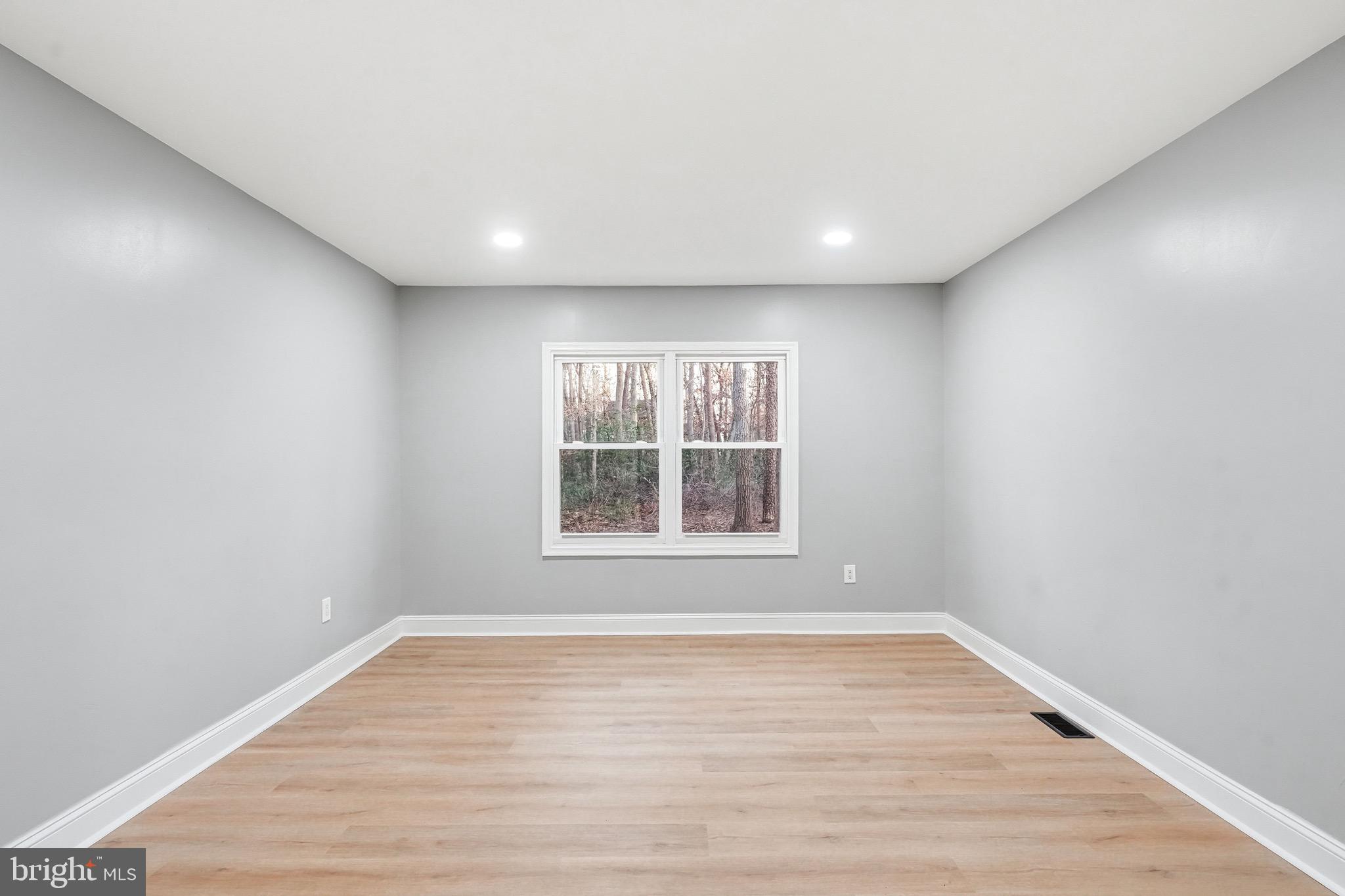 18 Waltham Drive Tabernacle, NJ 08088 - Photo 23 of 43 a view of an empty room with wooden floor and a window