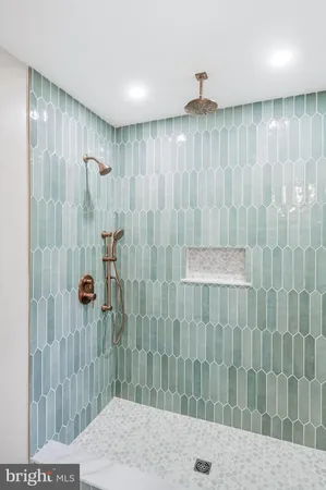 a bathroom with a shower and a sink