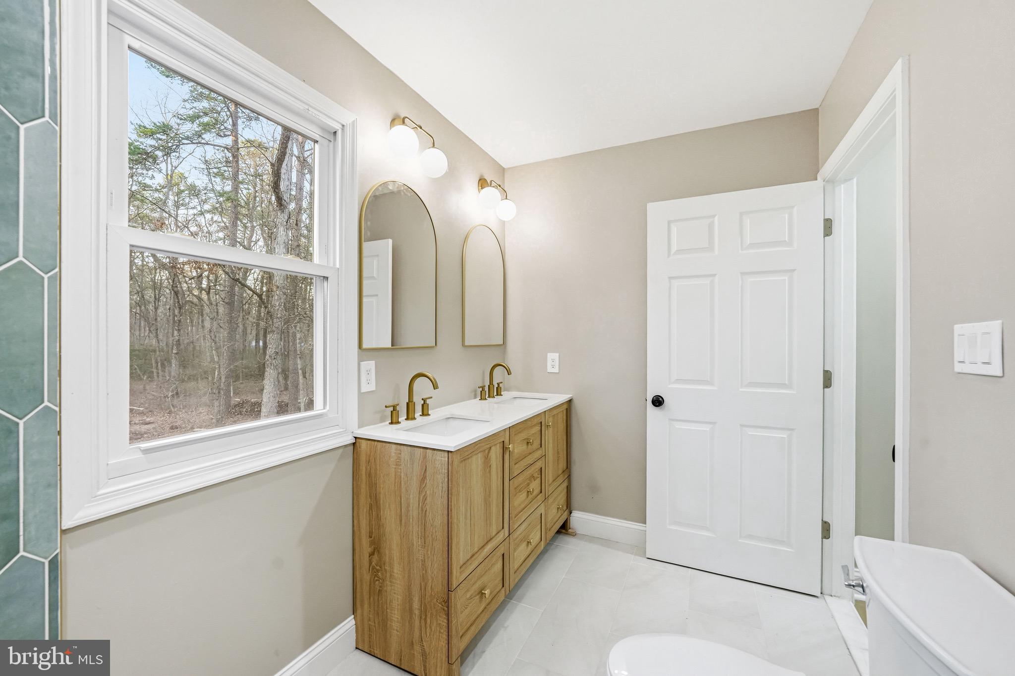 18 Waltham Drive Tabernacle, NJ 08088 - Photo 38 of 43 a bathroom with a double vanity sink toilet and shower