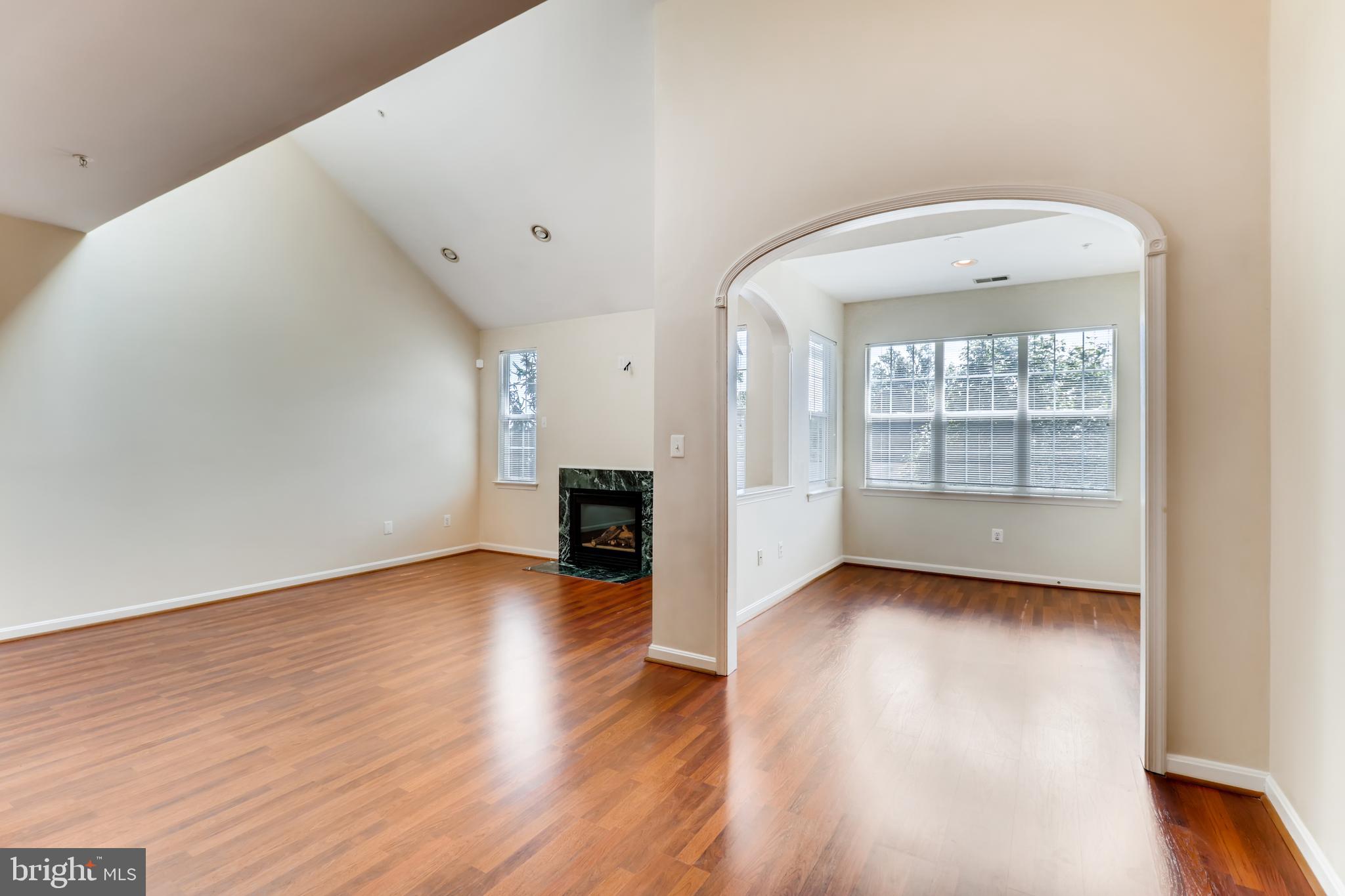 25 Hawk Rise Lane, Unit 303 Owings Mills, MD 21117 - Photo 7 of 27 Living room into dining room