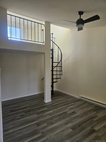 a view of an entryway with wooden floor