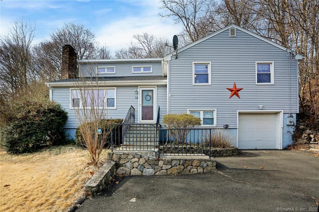 13 Cornwall Road Norwalk, CT 06850 - Photo 1 of 1 a view of a house with backyard and sitting area