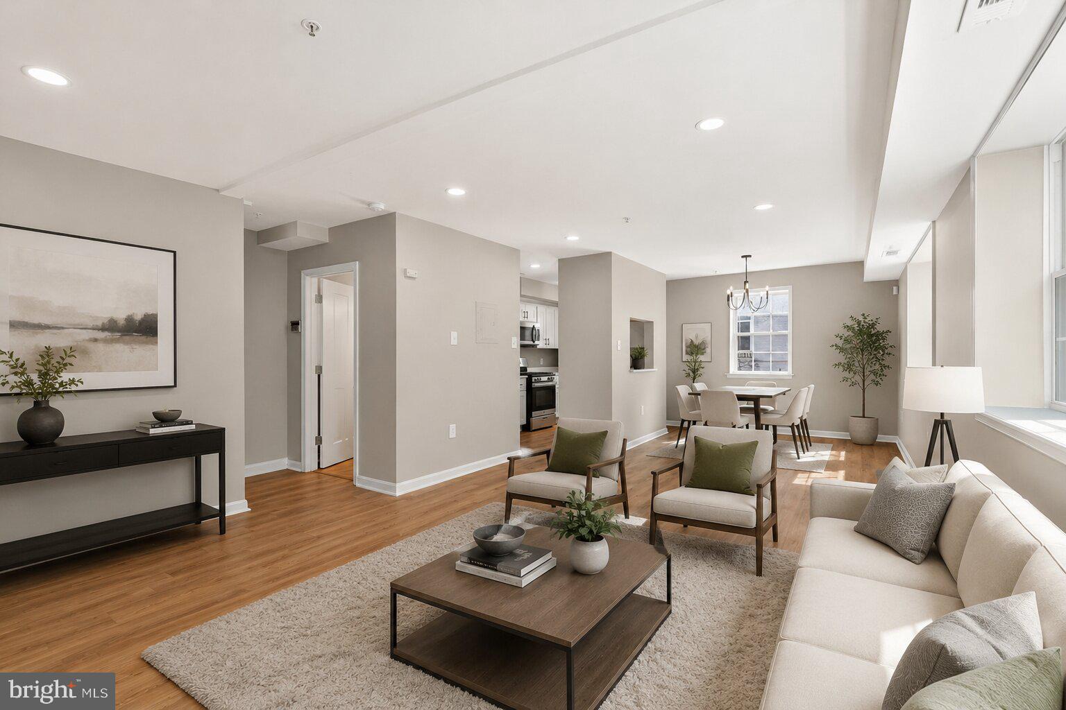 1008 Rittenhouse Street Northwest, Unit 15 Washington, DC 20011 - Photo 5 of 39 a living room with furniture and wooden floor