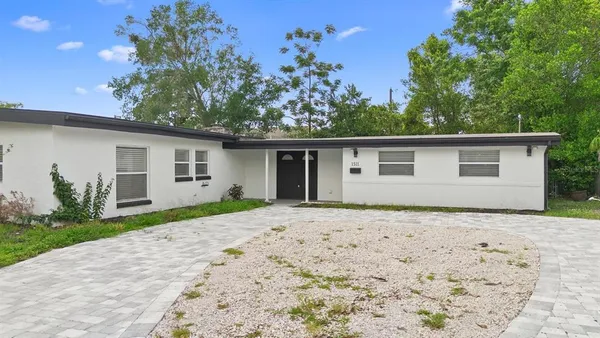 a house with trees in the background