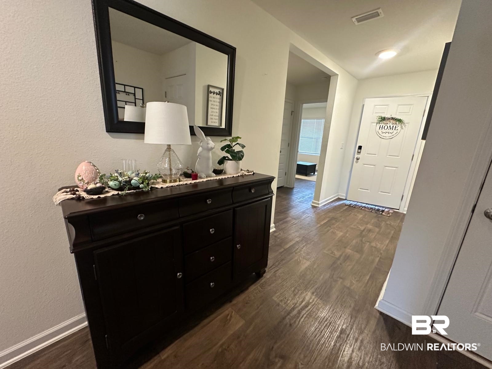 23792 Unbridled Loop Daphne, AL 36526 - Photo 4 of 36 Foyer entrance with dark wood-type flooring and baseboards