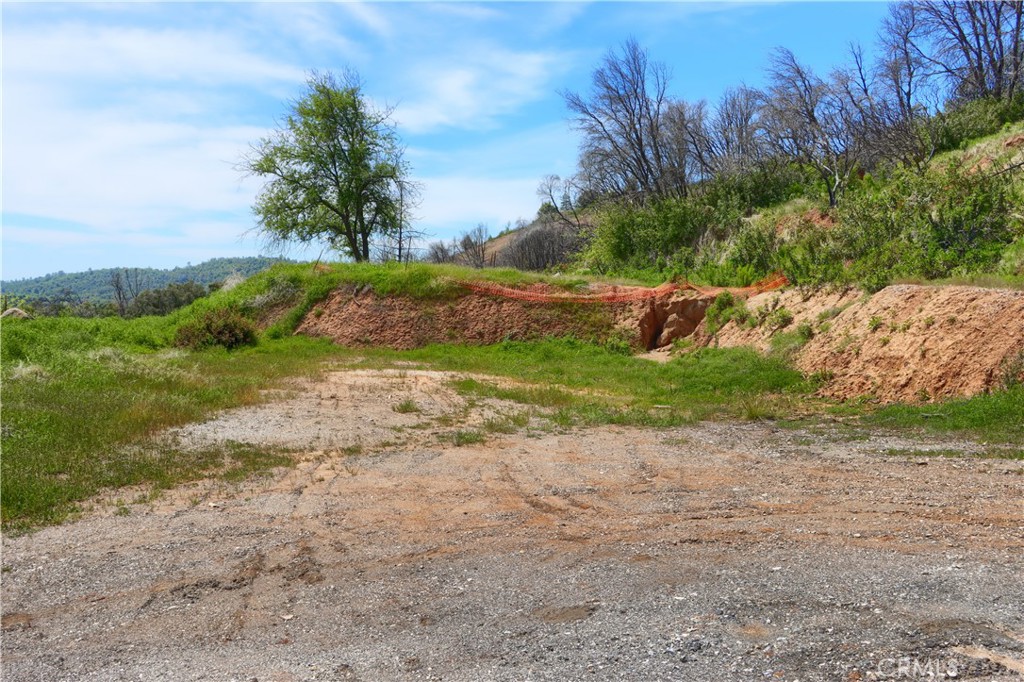4632 Triangle Road Mariposa, CA 95338 - Photo 11 of 26 a view of a dirt road with a building in the background